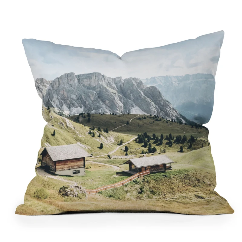 Dolomites Italy I Wooden chalets on the Seceda alpine meadow in the mountain of the Italian Alps Throw Pillow