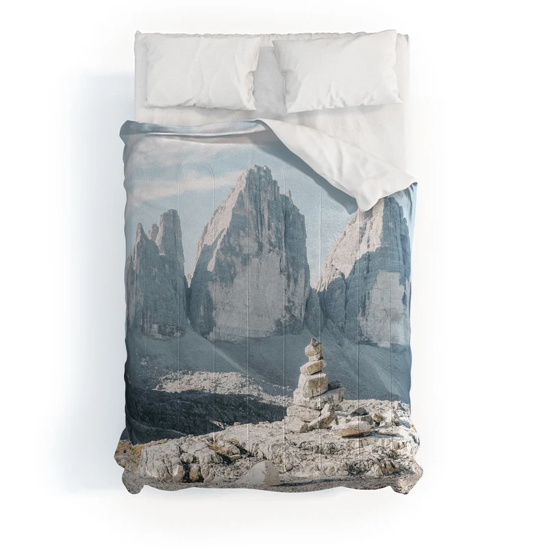 Dolomites Italy I Stone cairn in front of Tre Cime di Lavaredo peaks in the Italian Alps mountains Comforter