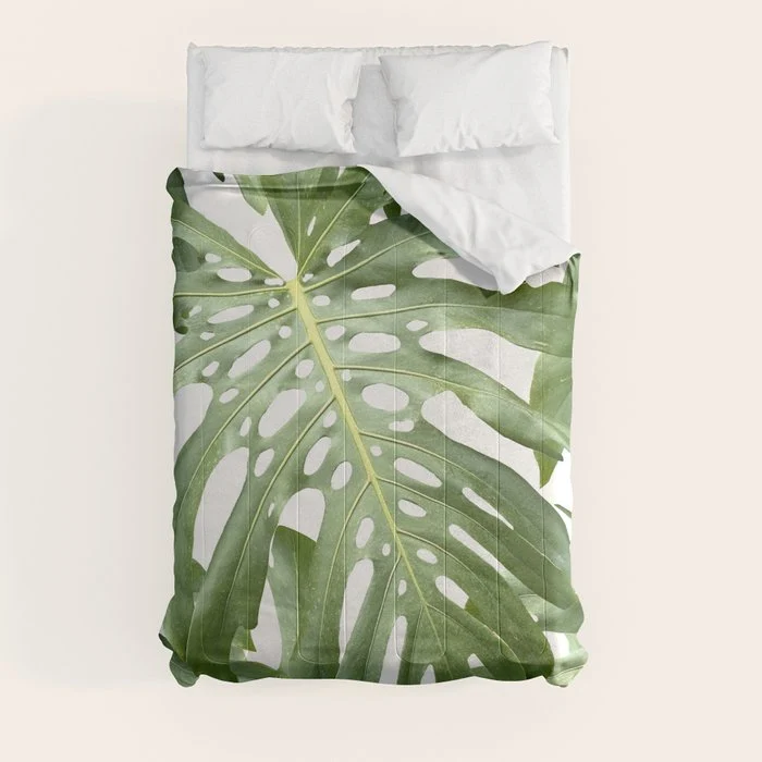 Vibrant tropical foliage on white Comforter