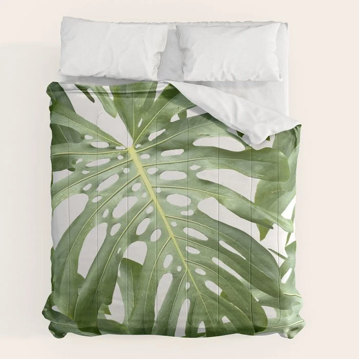 Vibrant tropical foliage on white Comforter