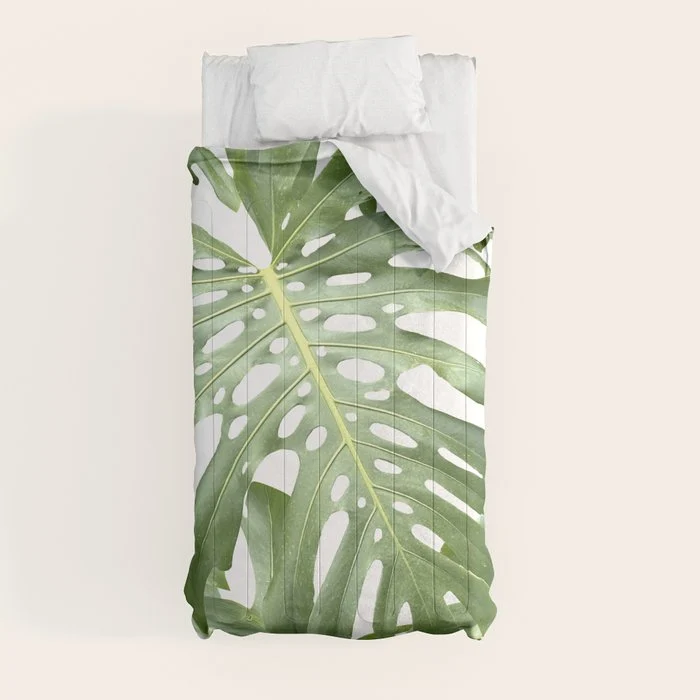 Vibrant tropical foliage on white Comforter